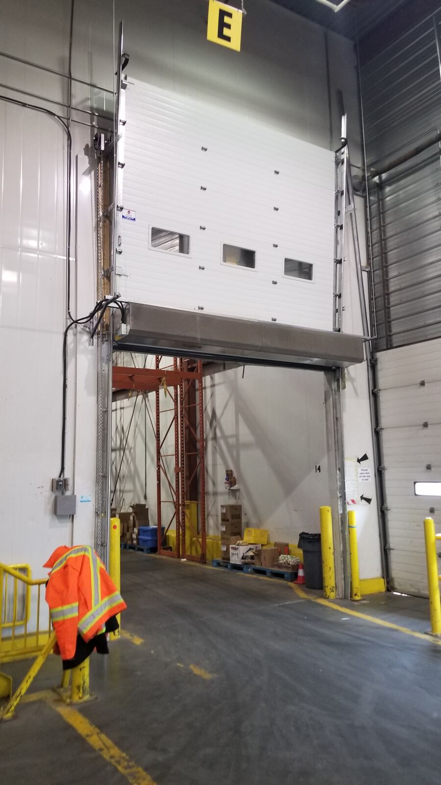 Cold storage overhead freezer door