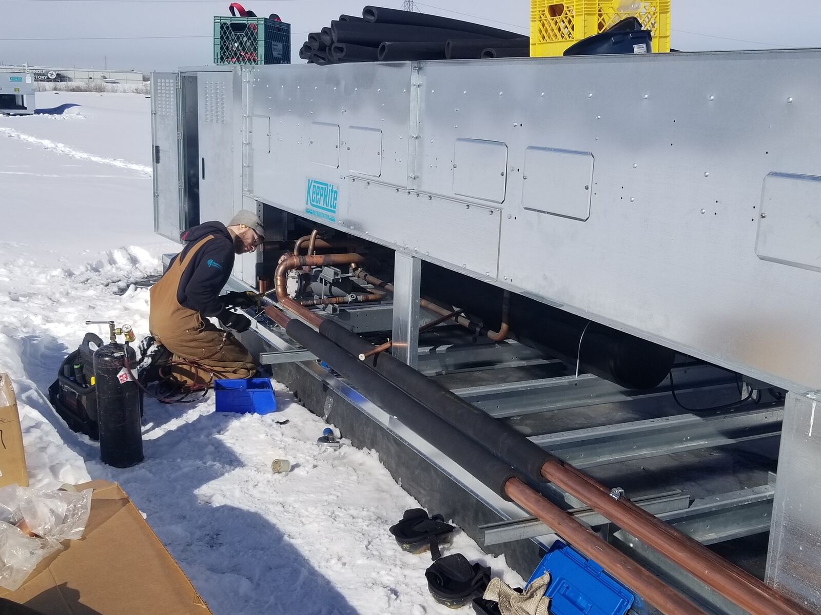 Technician winter condenser rack install