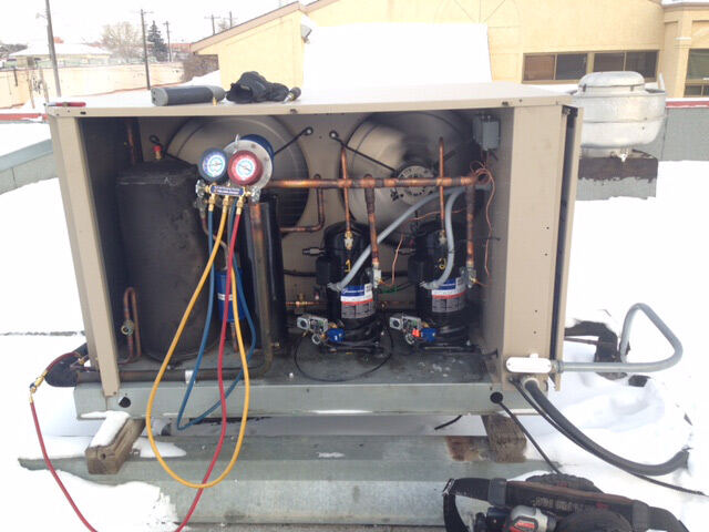 Technician winter rooftop service