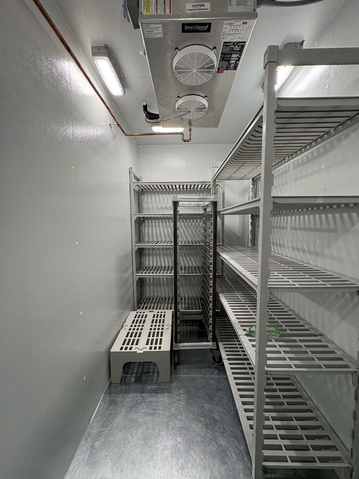 Walk-in cooler shelving evaporator