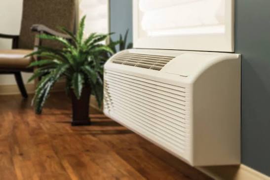 Packaged terminal air conditioner (PTAC) unit installed in a suite